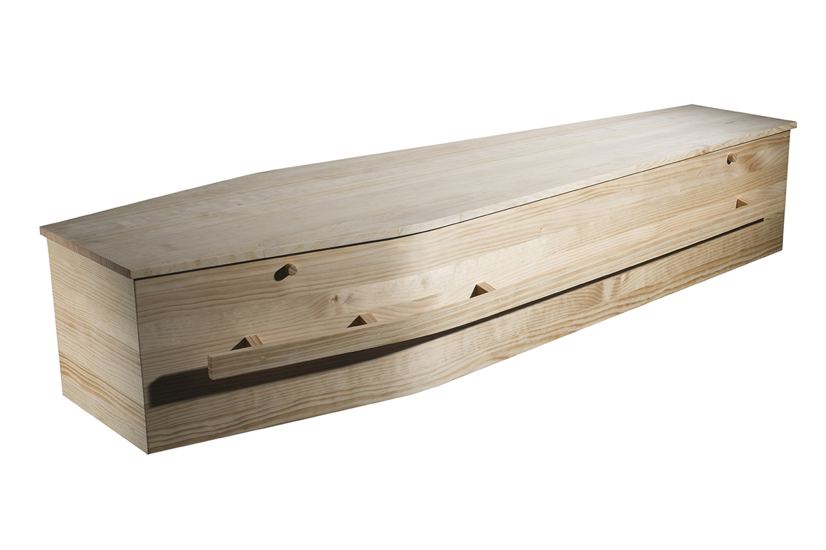 Architype Pine A modern take on a traditional shape. Finely finished pine casket with a subtle wax sheen. The handles are integrated in wood so metal or plastic handles are not required. The interior is a feature and does not need to be hidden with fabric. The lid is fixed by wooden keys (supplied) and can be clipped to the sides when open.
