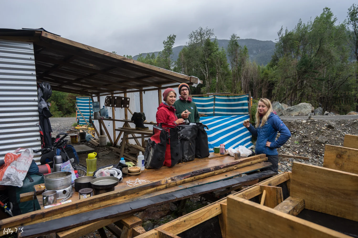 Our least romantic camp spot. Desperate to find shelter from the rain, we hide under this construction site roof. 