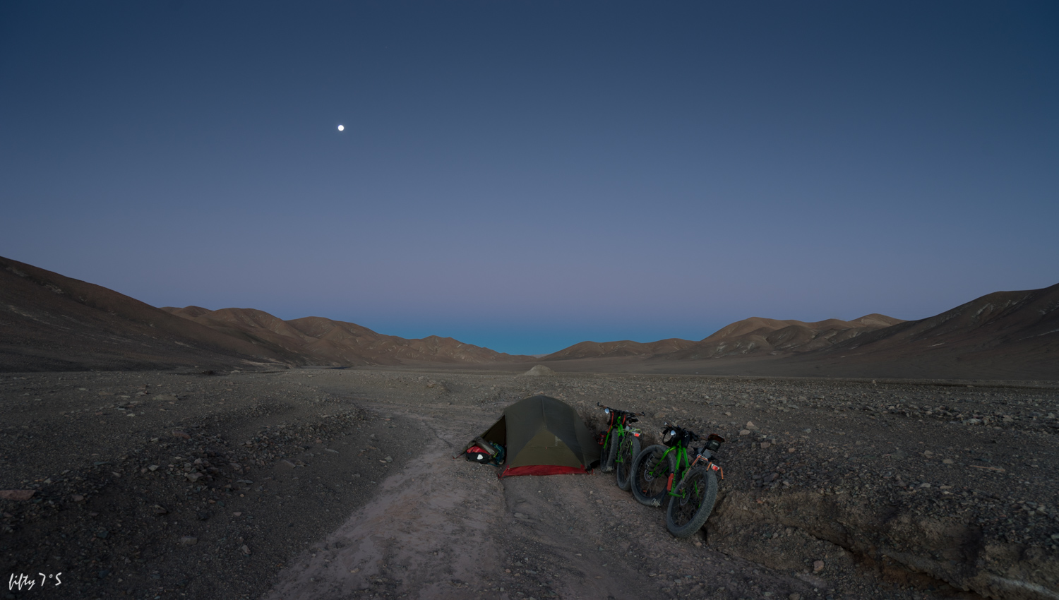 Wild camp spot before the route high point. Found a little shelter from the wind in a river bed.