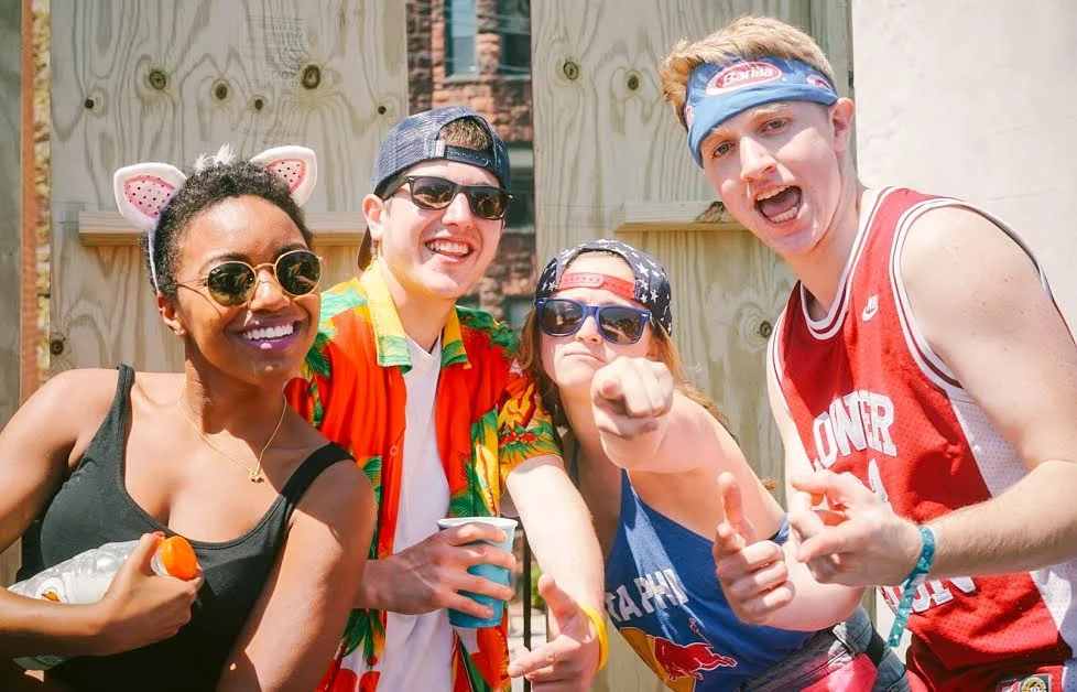 Left to right: Laura Anderson DC ‘17, Ali Lieberman ‘18, Harrison Tracy ‘18 Whether a backwards baseball cap or more avant-garde bandannas with logos and animal ears, headgear is a must for Spring Fling.