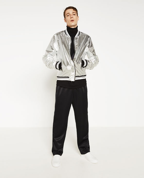 Source: Zara ZARA (The focus is not just the very outlandish silver bomber jacket, but also what it’s paired with – color block kitsch with bold but silent hues like black, white, beige and a certain kind of green.)