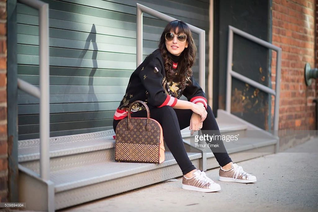 Source: Getty Images Gucci blouse w/ Adidas sneakers