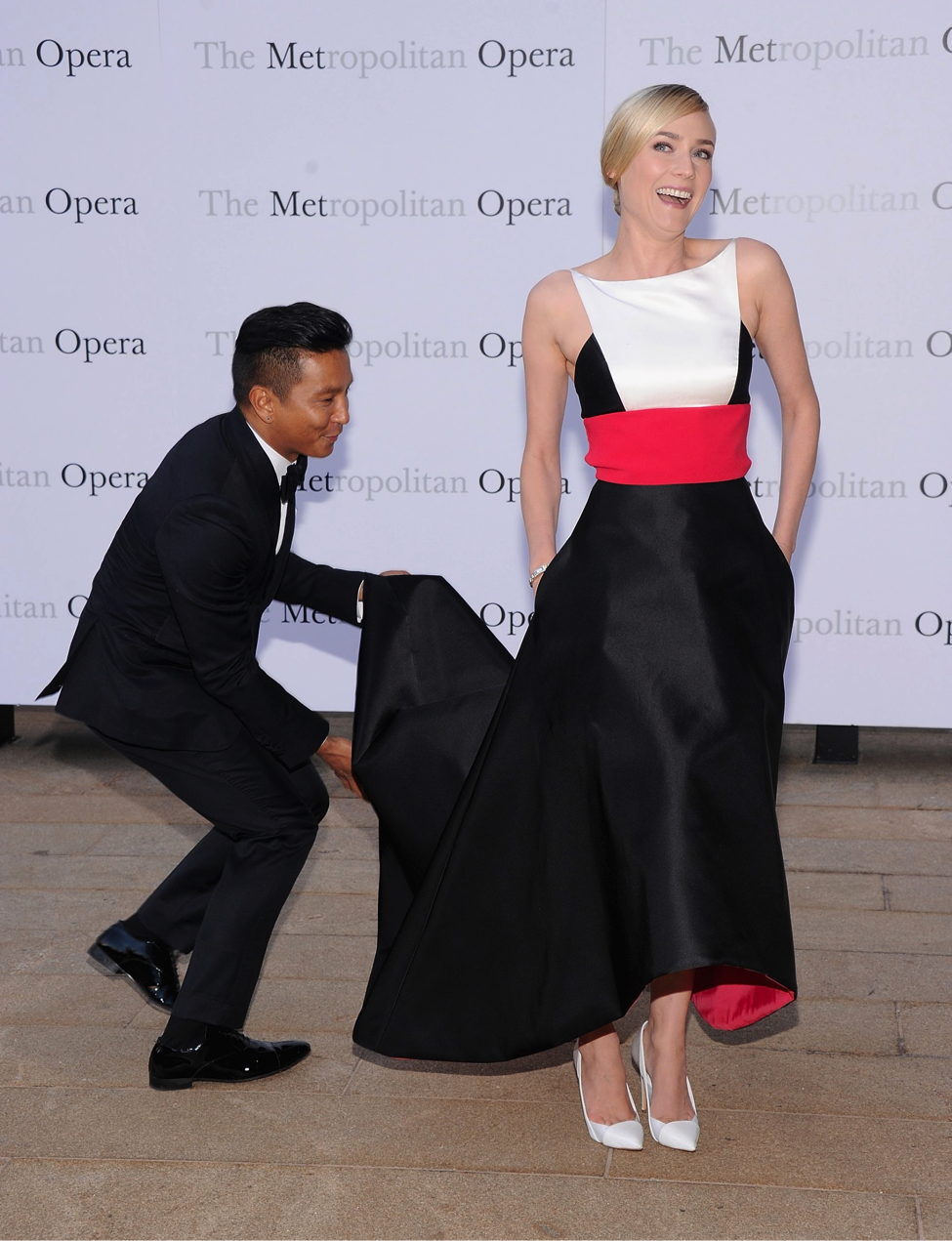 Designer Prabal Gurung accompanies actress Diane Kruger, who is wearing one of his designs, on the red carpet. Image via Pop Sugar