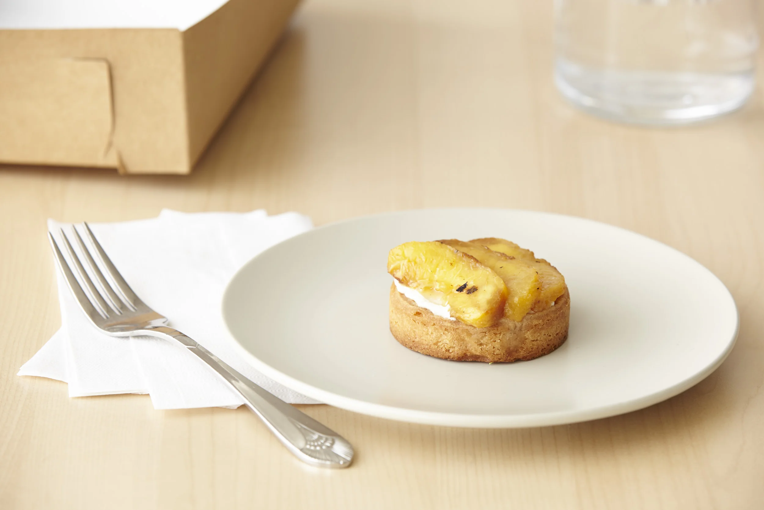 Grilled Peach Tart Almond Shortbread crust filled with vanilla mascarpone topped with grilled peaches.