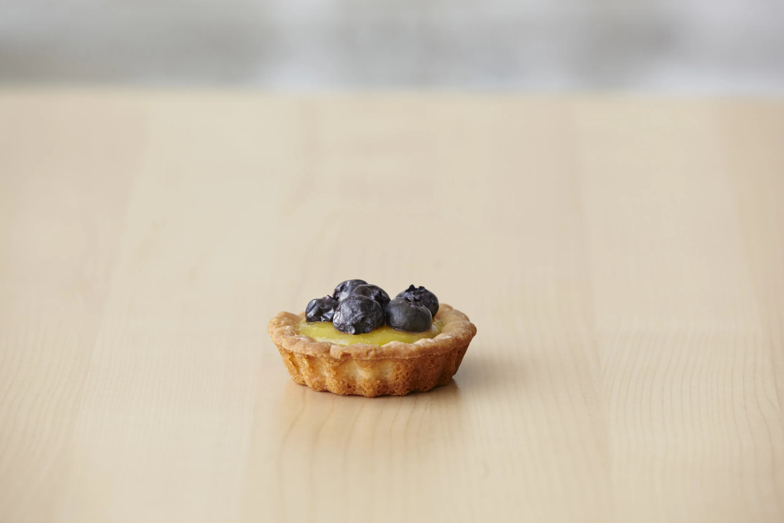 Lemon Blueberry Tart Lemon shortbread filled with our house made lemon curd topped with cinnamon infused blueberrries