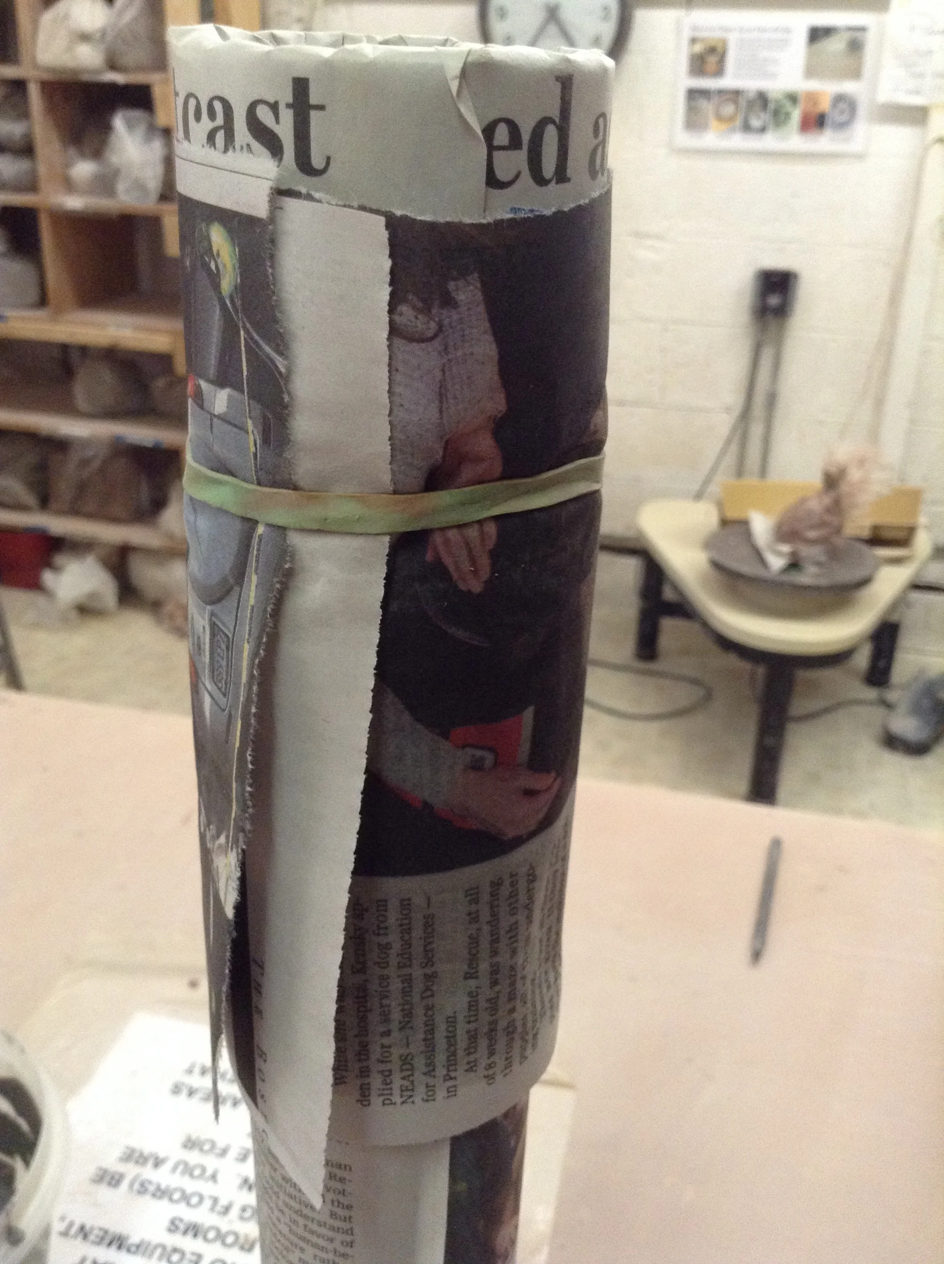 The tube itself has paper on it to enable the clay sleeve to be removed when it is stabilized enough to hold its shape. Removed too soon, the clay form will slump into something less round. Removed too late, and the clay shell will crack from shrinkage around rigid tube, or careless flexing movement.