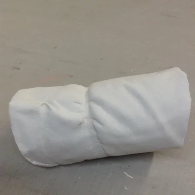 Good view of the rubber band tightening around the form, leaving marks in the clay.