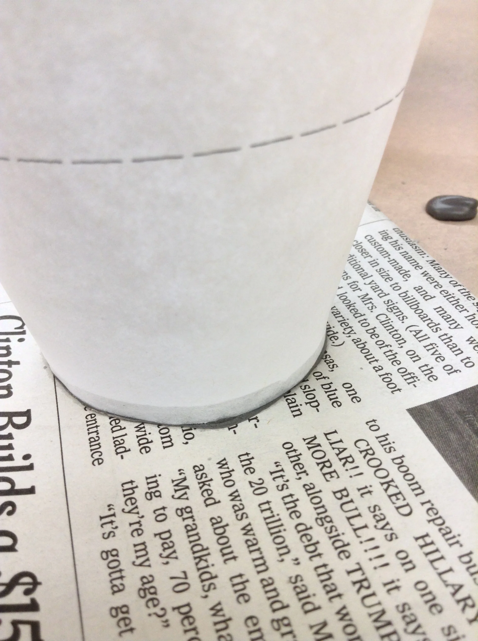 Detail of clay slip visible through translucent paper. No leaking!