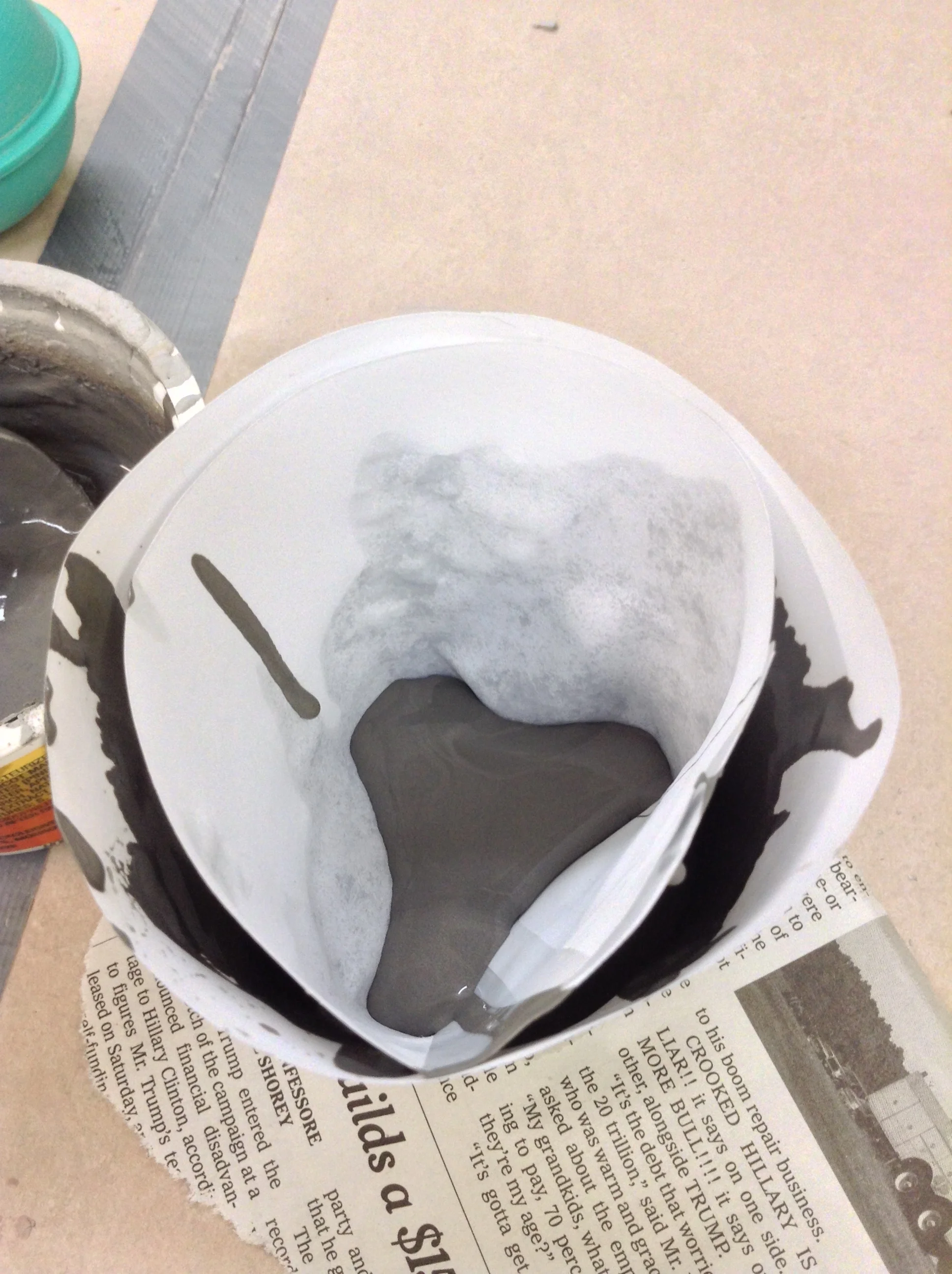 After a little pouring, both paper cones soften. Inner cone folds upwards as simple seal fails and leaks wall slip into interior space.
