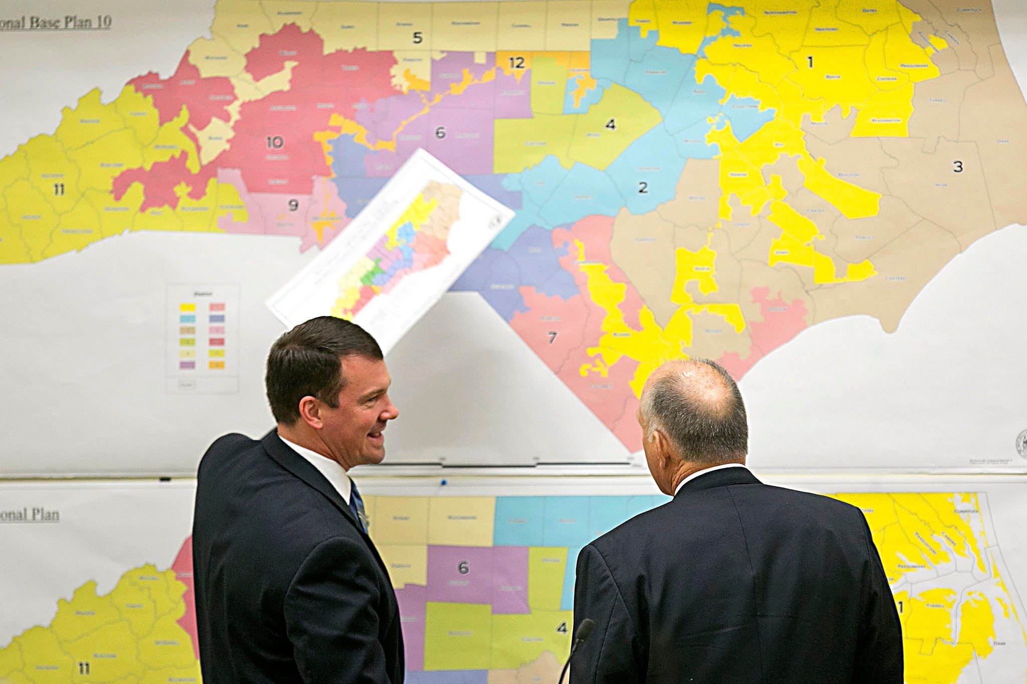  Republican State Senators Dan Soucek, left, and Brent Jackson review historic maps during a special legislative session in 2016 to set North Carolina’s 13 congressional districts.  Corey Lowenstein/ The News &amp; Observer , via Associated Press 