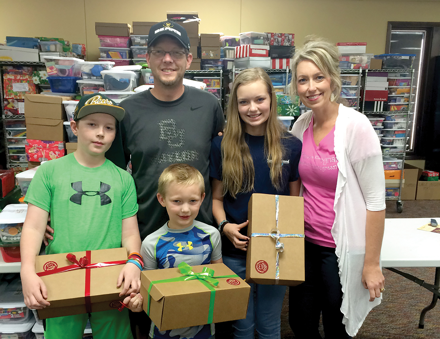 The Butler family from Texas was on vacation in Orlando, and spent a day helping process shoeboxes.