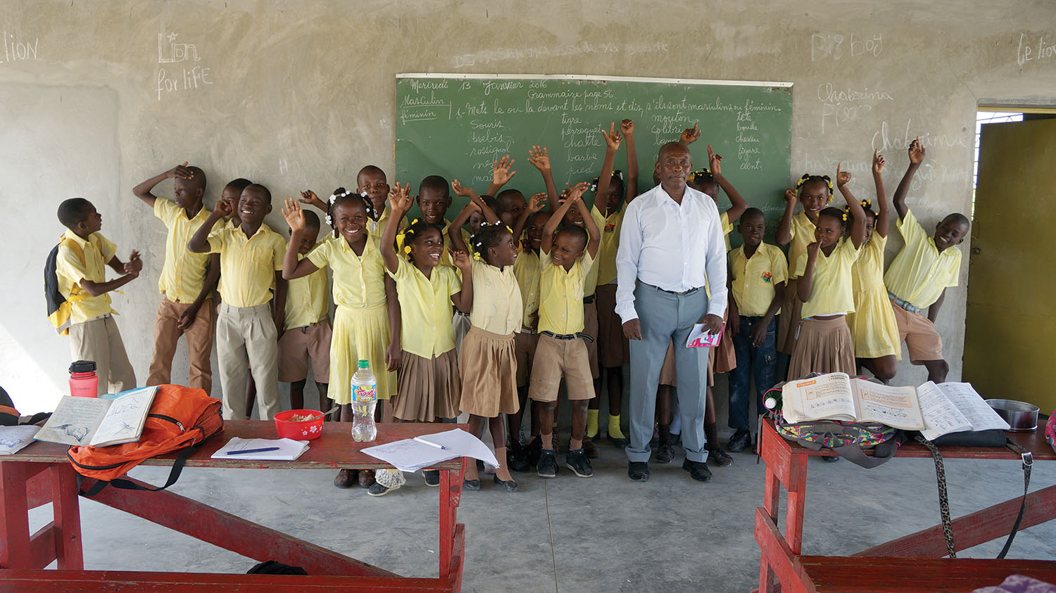 Samuel Joseph was thrilled to stand with his class of students. They love their school and their teacher. 