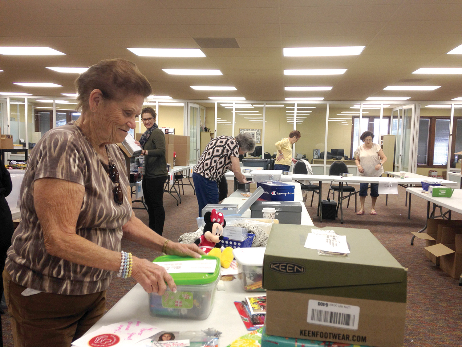 Volunteers serving in Orlando, Florida, help us pack and ship shoebox gifts to Haiti.