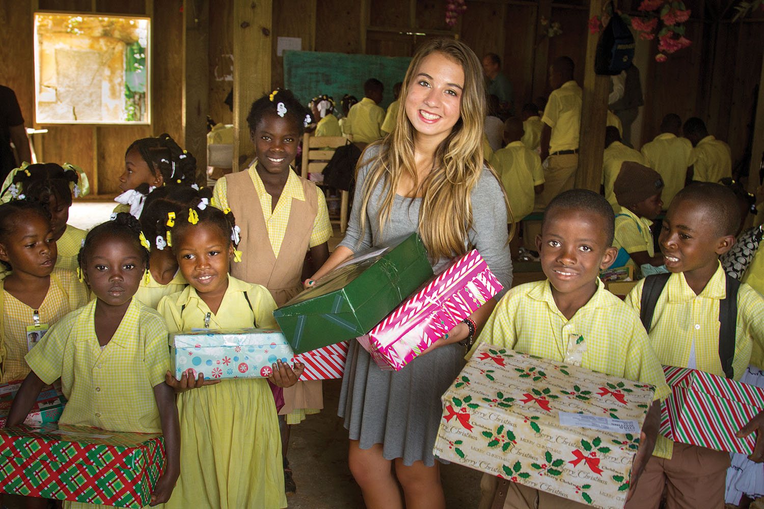 Katie gave gifts to the children knowing each shoebox would bring smiles and hope to a child and their family.