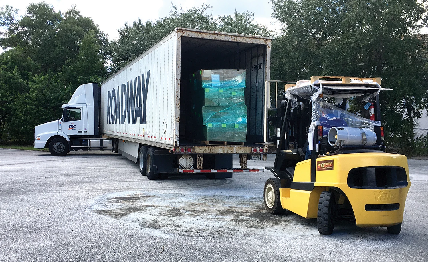 Shoeboxes arrive in Orlando, and then are cased prior to being loaded on a cargo container for shipment to Haiti.