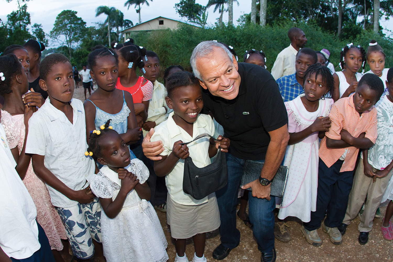 Pastor Johnny Hunt from First Baptist Woodstock with his sponsored child, Rose, when they met for the first time.