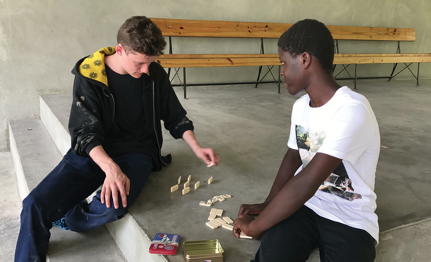 Meeting your sponsored child equals quality time to enjoy a game of Dominoes together.