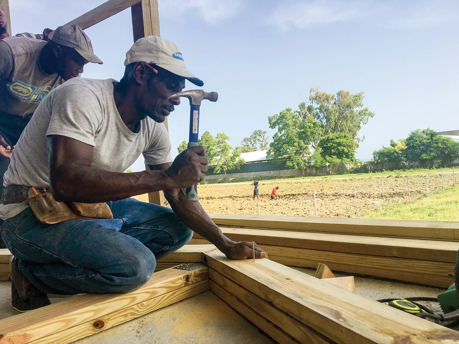 Carpenter Sonny works at New Missions making roofing trusses for our churches.