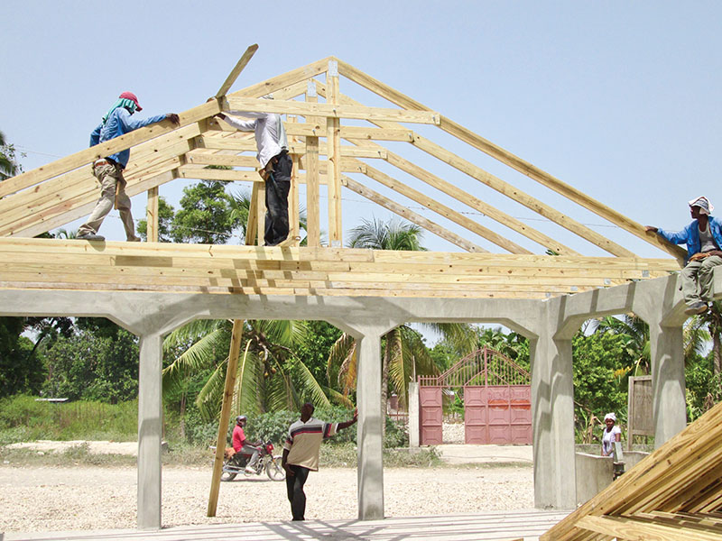 The roof trusses for our churches are made by Haitian carpenters at New Missions.