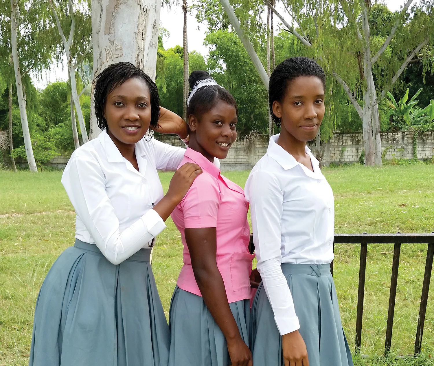 Djenie Fils-Aime (left) says, “I am the only one, and the first one in my family to finish high school. I love New Missions.”