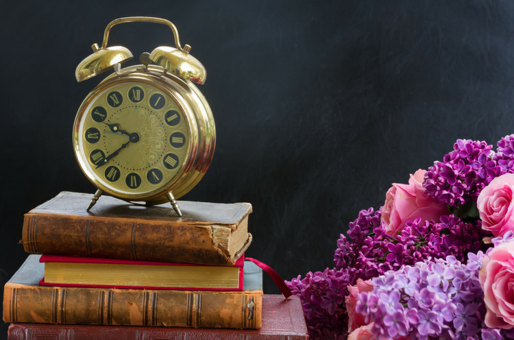 Blog.Pile of Books with Clock.png
