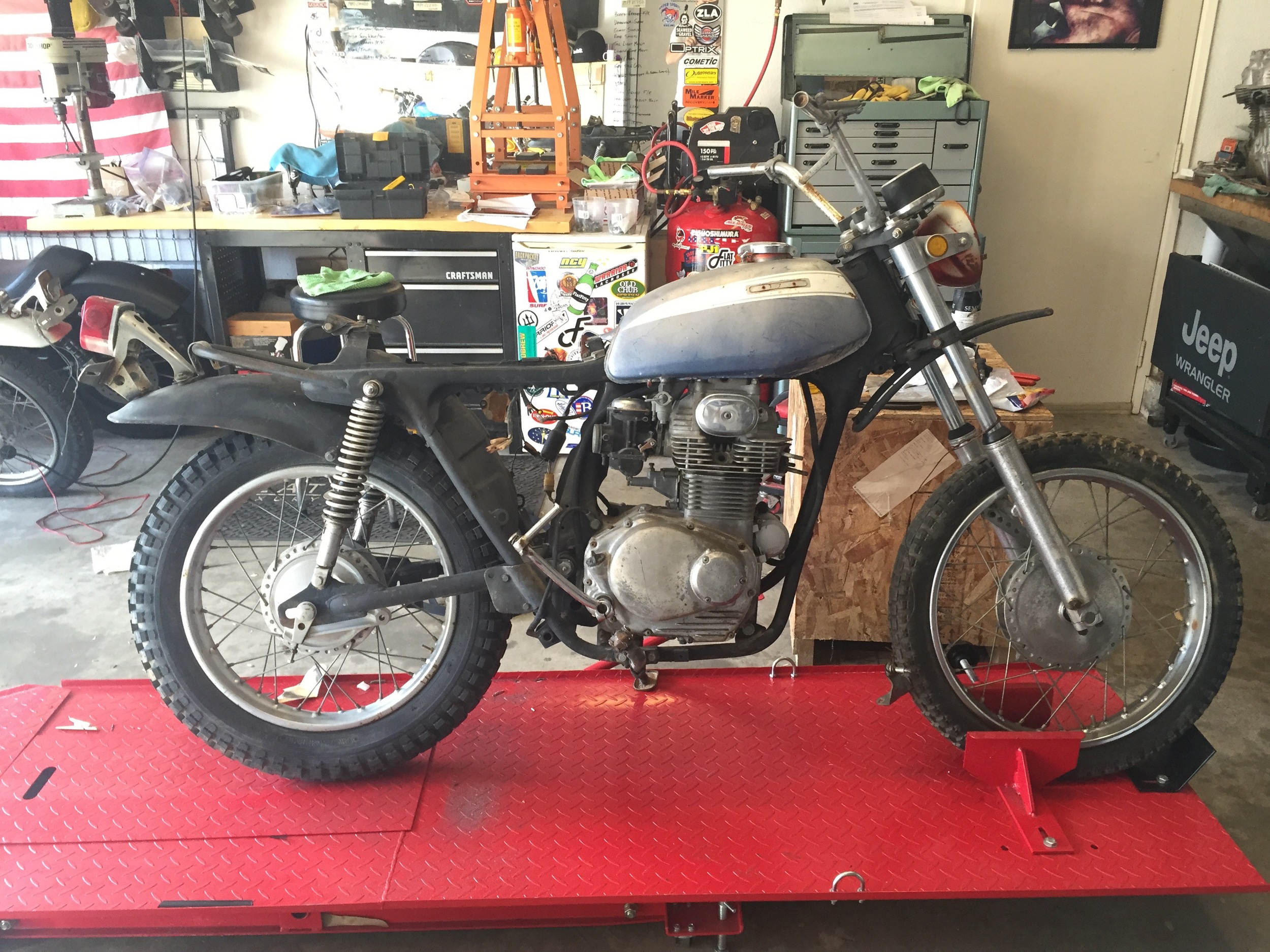 This bike was almost complete. Ugly and nowhere near running, but a good foundation for customization. I knew the frame geometry was going to limit the build to a tracker/scrambler style. My goal was to keep the spirit of the scrambler but eliminate the design features that make these vintage SLs look more function over fashion.