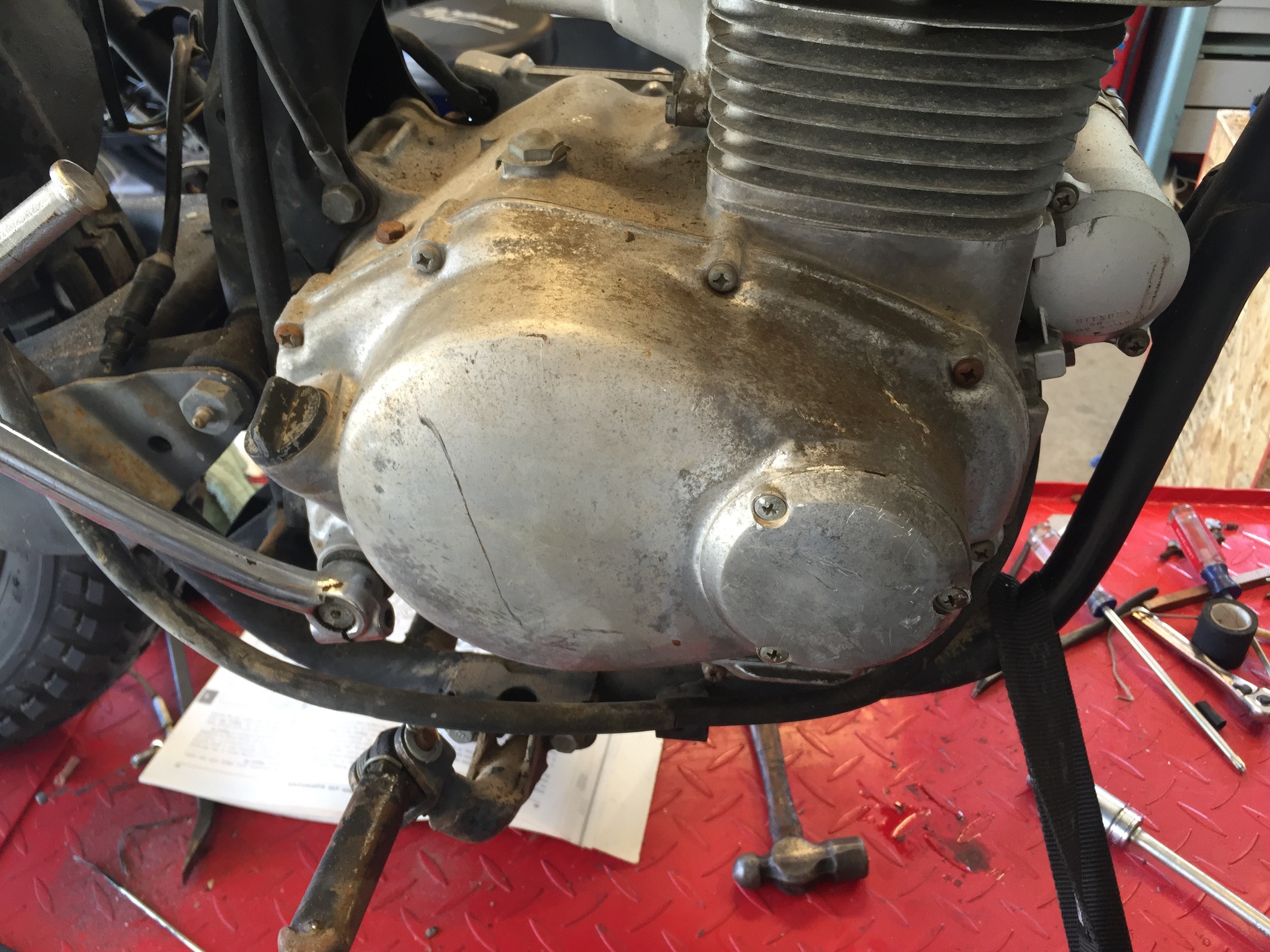 The before shot of the engine. This bike was sitting outside in the CA desert for 20+ years. On top of that, it was stored without spark plugs. There were black widows living inside the cylinder.