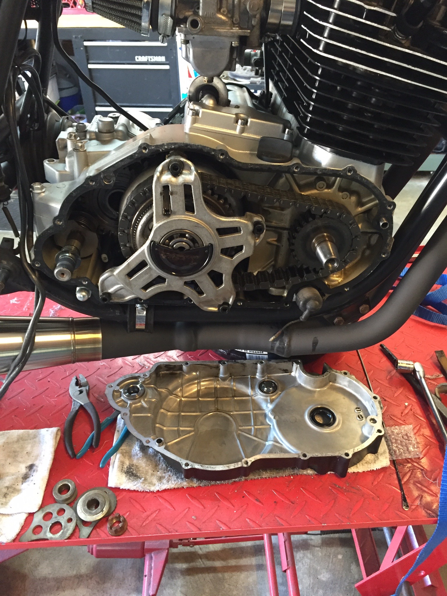 The flywheel needs to be pulled to remove the right side cover on the XS750. I recently loaned out my puller, so I had to improvise. Turns out the rear axle bolt from a K0 or K1 Honda SL350 is also a 16x1.5 thread pattern. This clutch will be rebuilt before lunch.
