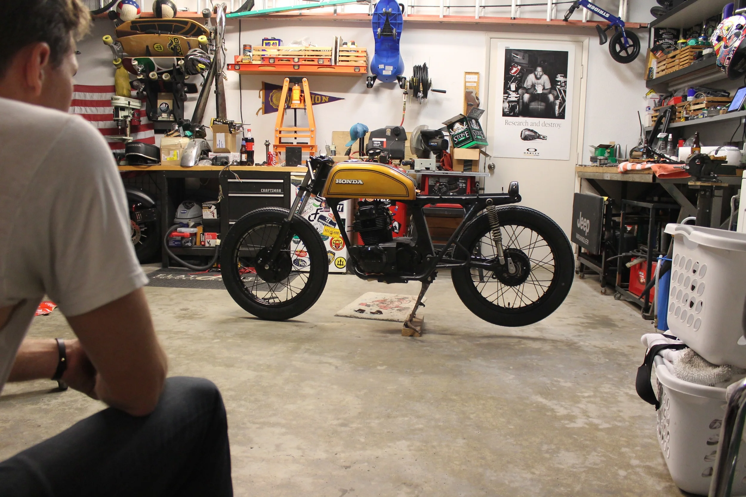 We spend countless hours doing just this in the Therapy Garage... Notice the block under the center stand. Not only did we mount Coker Firestone tires, but also went to a 18" front and rear to make this bike stand a little taller.