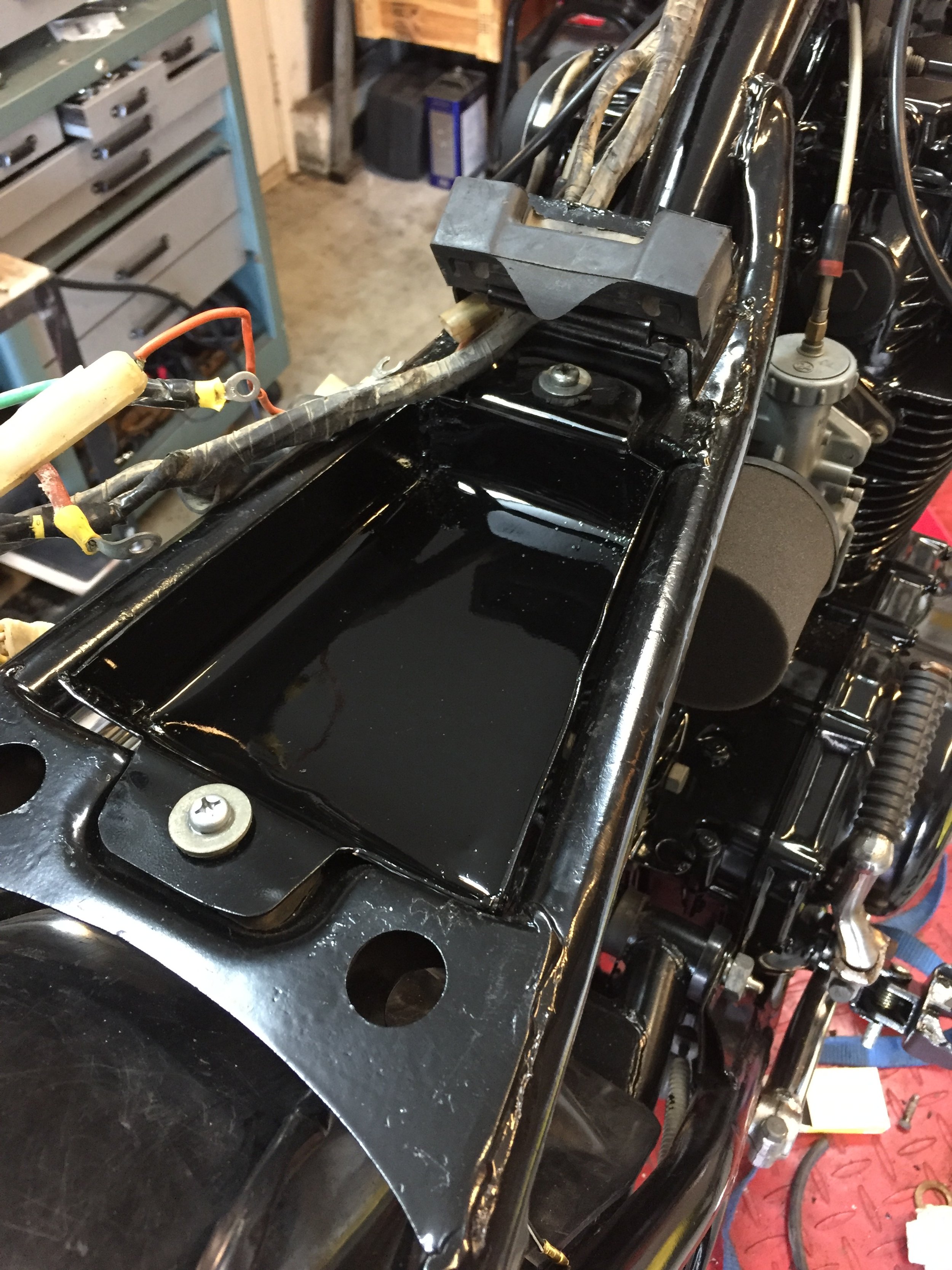  Some applications call for the electronics tray to be welded into place.  If we can fabricate something that bolts on, we will do our best.  This slick little tray is just big enough to accommodate a 4-cell AG401 battery from Antigravity.  This bike