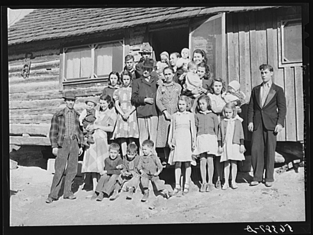 Noah Garland with his sons and some of their families. Southern Appalachian Project near Barbourville, Knox County, Kentucky, November 1940. Photographed by Marion Post Wolcott, courtesy U.S. Farm Security Administration.