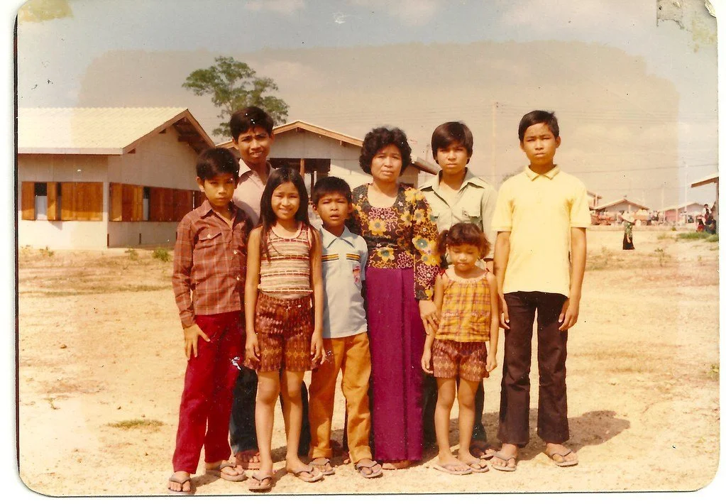 In a photograph from the new book Buried (Catfish Press, 2019; Vira Rama, Charles Fox), the Rama family at the Chonburi Transit Center, leaving their refugee camp in Thailand. Learn more below.