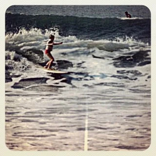 Eve Fletcher surfed for over 50 years, and was still hitting the water whenever she could until she hung up her surf board at 87 years old. She is one of the oldest female surfers. One of the stars of the 2001 award-winning documentary “Surfing for Life,” Eve has been regularly featured in newspapers, magazines, books, and film. Eve was working as a cartoon editor for Disney Studios when she took up surfing. One day she went to San Onofre Beach and ran into the most famous woman surfer at that time – Marge Calhoun. Eve recalls “I had a surfboard with me and I remember asking her ‘How do you do this?’ ‘You just paddle and then stand up,’ Marge answered. That was many years ago, and we are still dear friends.” Eve and Marge enjoyed the welcoming embrace of Hawaiian waters and the young women surfed all over the island, causing quite a stir amongst the locals. They were talked into entering the Makaha International contest, and Marge won first place. “Back in the days when I took up surfing, the fellows didn’t really like us out there in the lineup, much less catching a wave with them. Most of them respected us once they saw we were capable. When they saw we were serious and strong enough, it was a different story. I am glad if I have inspired some young women to keep trying, to keep getting better and better.”#butchhistory
