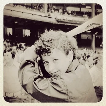 I love Maria Pepe. In 1972, at age 12, she pitched three Little League games for a Young Democrats team in Hoboken, New Jersey. She was promptly featured in the local paper, in a photo at home plate with the umpire and the curious caption which in part read, “while Naria Pepe waits his turn at bat.” It is still uncertain whether the misspelled first name and gender switch was an unintentional typo or the work of an editor unwilling to acknowledge in print that a girl was playing ball. But it didn’t take long for that same paper and other local dailies to reveal her real identity. Opposing team’ parents said it was a disgrace for a girl to be out there with boys. Pepe was asked to leave the team after the Little League “threatened to revoke Hoboken’s charter,” because Pepe was female. The girl athletic enough to beat out boys in try-outs, would never play another Little League game again. Pepe’s parents gave The National Organization For Women (NOW) the permission to file a gender discrimination lawsuit on their daughter’s behalf against Little League to allow girls to play. Over the next year instead, Pepe would hear about Little League’s testimony in favor of discriminating against women and disallowing them into their organization. Little League submitted that girls’ bone strength, muscle strength and reaction time were inferior to those of boys. On November 7, 1973, the court ruled in favor of Pepe stating: “The institution of Little League Baseball is as American as the hot dog and apple pie. There is no reason why that part of Americana should be withheld from girls.” As a result, the Little League organization began a program specifically for girls starting in 1974. Unfortunately Maria Pepe was not among them. By that time she was 14 years of age, too old for the league which then only enrolled 8-12 year olds. But in 2003, thirty years after the New Jersey Superior Court’s ruling, The Little League headquarters called. It was the first time she had ever had any personal contact with them. They wanted her to throw out the ceremonial first pitch of the 2004 Little League Baseball World Series in Williamsport and asked if she would lend her cap and glove