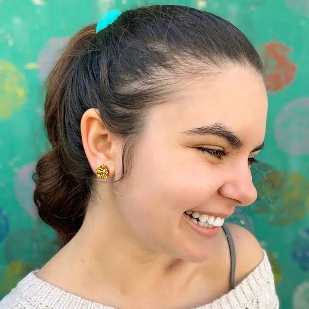 Teeny Tiny Gold Pomegranate Studs on jessie!