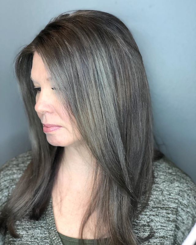Helping Melanie grow out her natural gray in a graceful way! This process isn&rsquo;t easy or perfect, but our goal was to get rid of the existing chocolates brown base, adding in gray and silver while leaving her regrowth alone so it can all grow in
