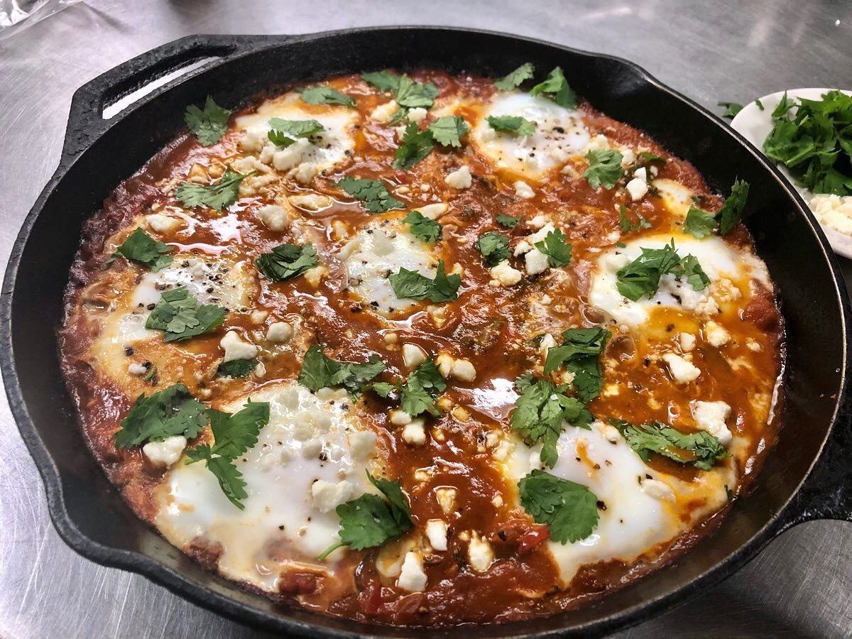 Hope all is well! I took the classic #shakshuka south of the border w/ a Mexican inspired twist today for breakfast at the 🔥🏚. Onions, Swiss chard &amp; red peppers 🛀 in a guajillo &amp; chipotle sauce topped w/ eggs, queso fresco, &amp; cilantro.