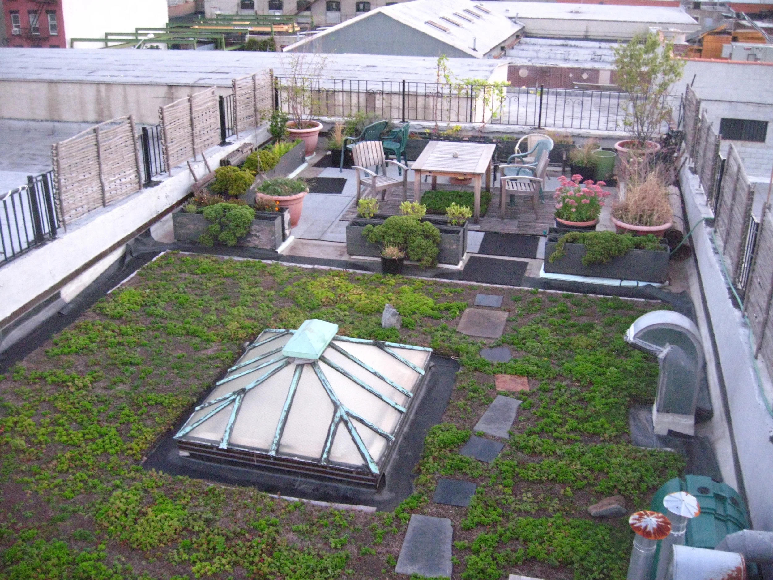  &nbsp;The drought tolerant sedum blankets and the planters full of native species give this roof a natural feeling. 