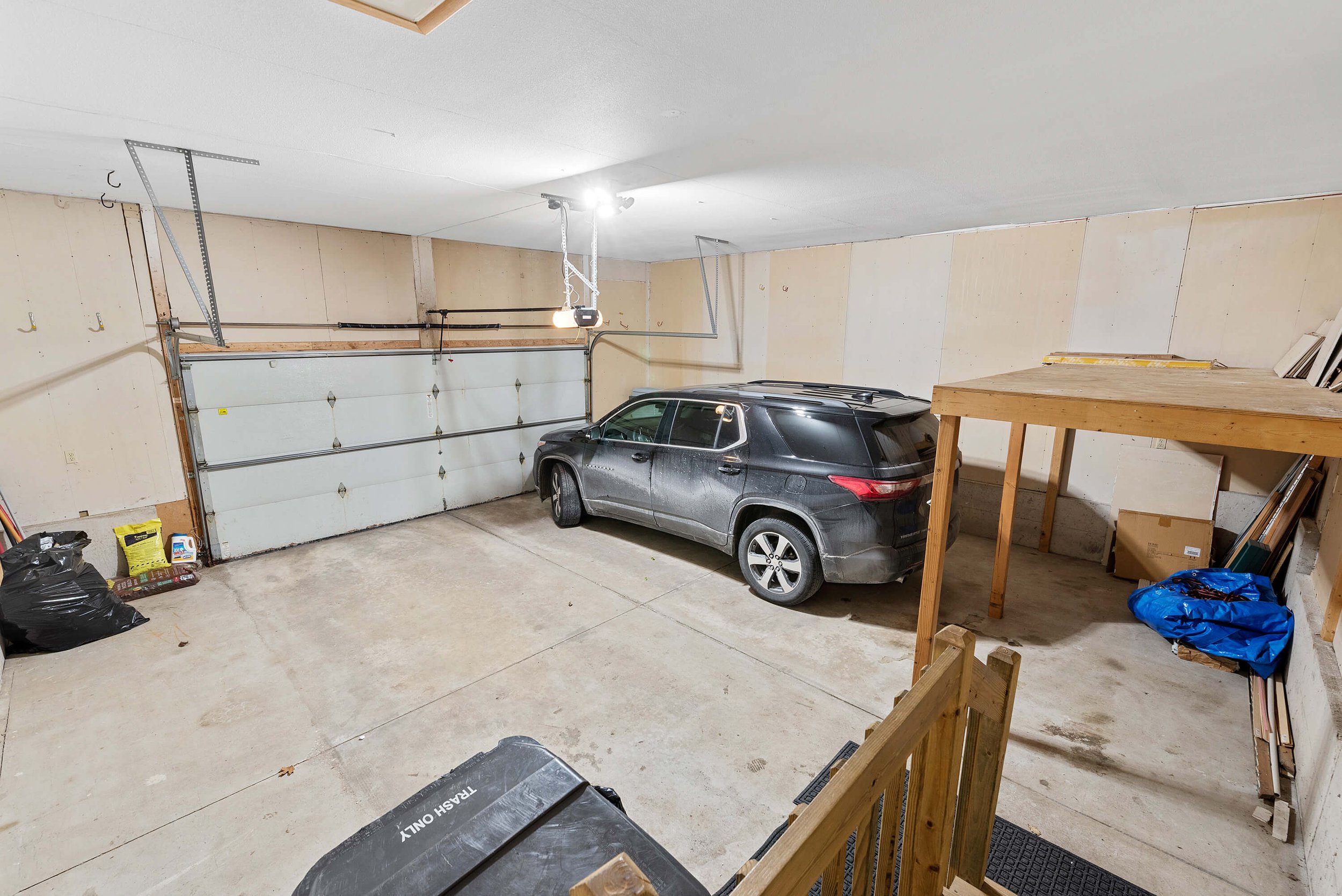 Grand Garage with Volume Ceiling and Storage