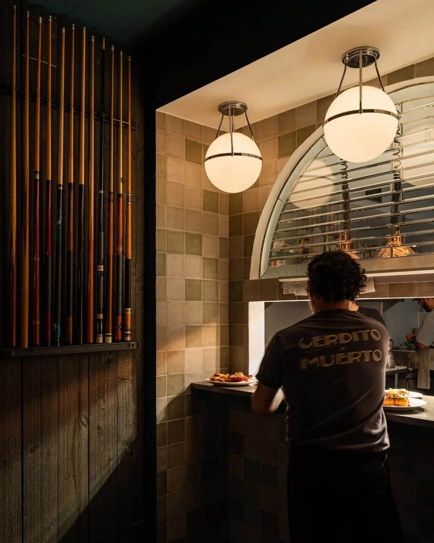 Once a family-run pool hall, now a buzz-worthy family-run gastro-bar &mdash; Cerdito Muerto keeps its roots close. Retired pool cues flank the kitchen window, vintage photos capture the building&rsquo;s past, and the same family behind Tacos Palacio 