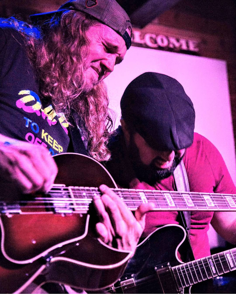 Clint and Brian getting chummy on stage