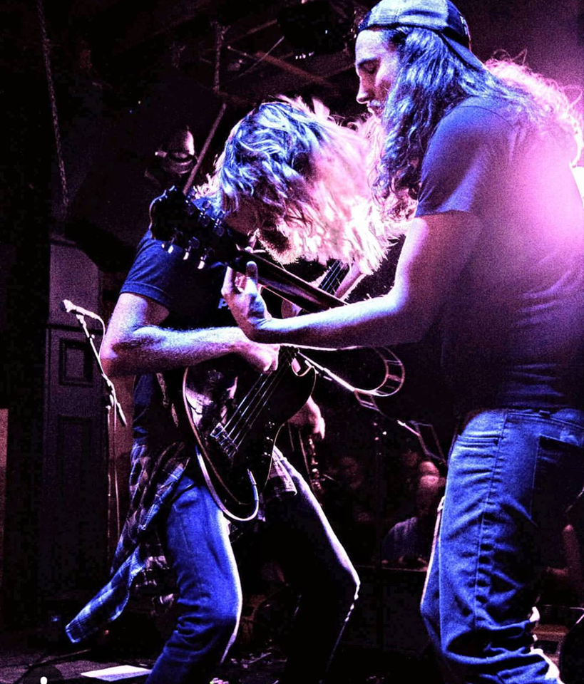 Brett and Clint getting chummy on stage