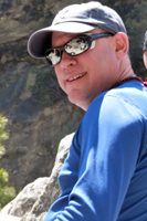 Gordon is a founding member of Alpine Ascents and is responsible for overseeing all operations and creating written materials, researching climbing and cultural histories. He manages all aspects of the business, our office and is our marketing expert with a keen interest in client care and customer service. Details, details, details… On the travel front, he is a long-time independent traveler, and scouts new locations such around the globe with a particular focus on the Indian subcontinent. Most recently Gordon lectured in and visited Kosovo and the Western Balkans; and the region of Ladakh, India researching new trekking areas. Over the last 30 years he has spent over 5 years in the India region, visiting states such as remote as the hill tribe region of Nagaland, with other intrepid journeys to Mongolia, Iran and Yemen. Gordon leads most of our India trips, such as treks or private journeys such as the art and architecture tour of Central India. As a writer, he has had both fiction and travel works published in the U.S. and India. Gordon has served as an Indian subcontinent expert for numerous media sources such the New York Times, BBC and Outside Magazine and has appeared on CNN, MSNBC and the NBC Nightly News. Gordon and his family joined our trek to Everest base camp, introducing his kids to the joys of Asian travel. Any other "spare" time Gord can be found coaching ice hockey in rinks of the Northwest and Canada.