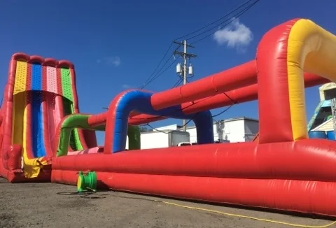 Get ready for a triple good time with the all new Drop Out Triple. This slide will make you triple take…. 3 lanes for 3 times the fun and 3 times the throughput. It has the look and feel of a State Fair Super Slide and can be used wet or dry and is a guaranteed crowd please for any fair festival! People Per Hour: 60+ Power Requirement: (3) 20 AMPS Set-up Time: 1 Hour Space Required: 80’ x 15’ x 32’