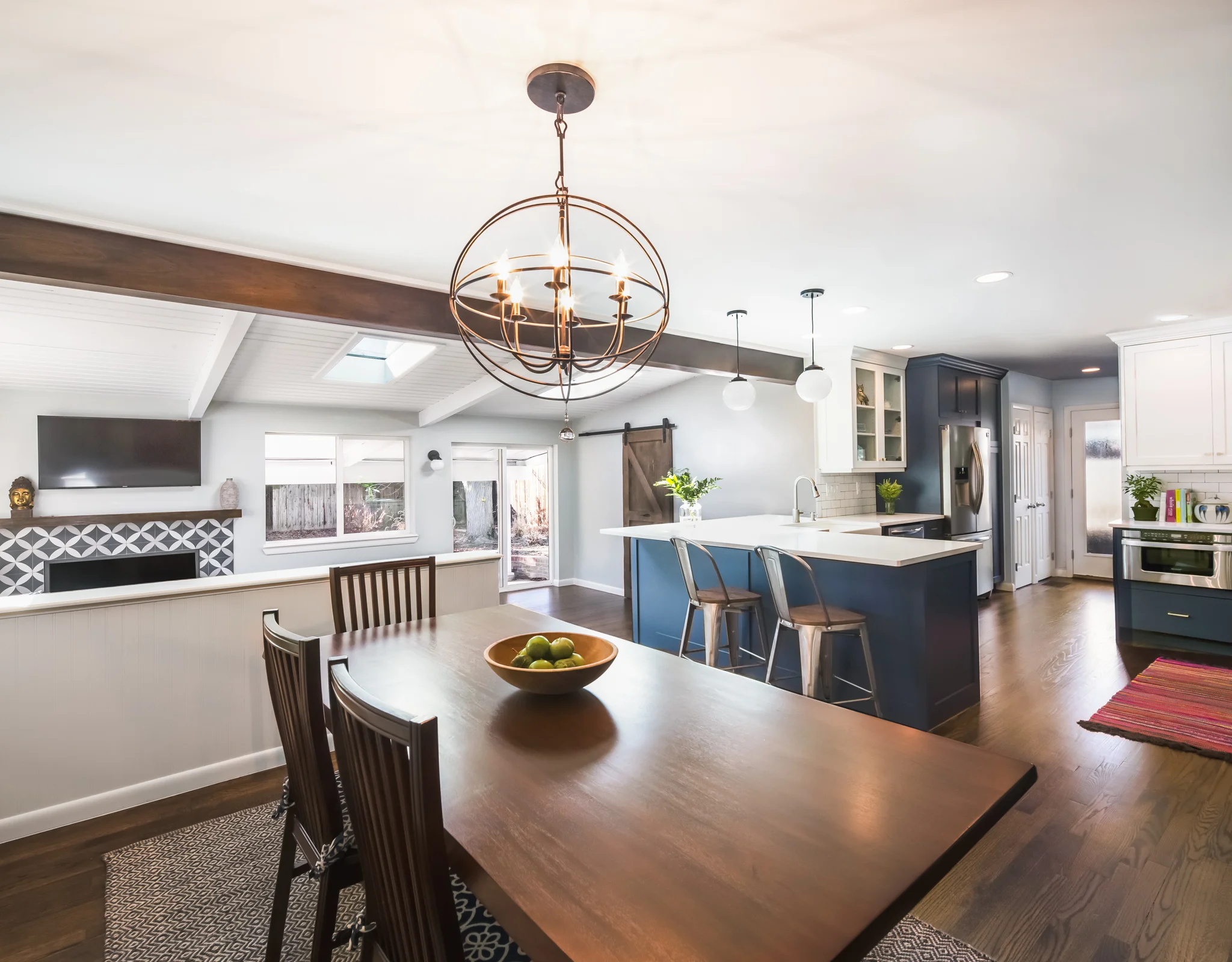 We encased the beam in alder and stained it to match the newly refinished floor.