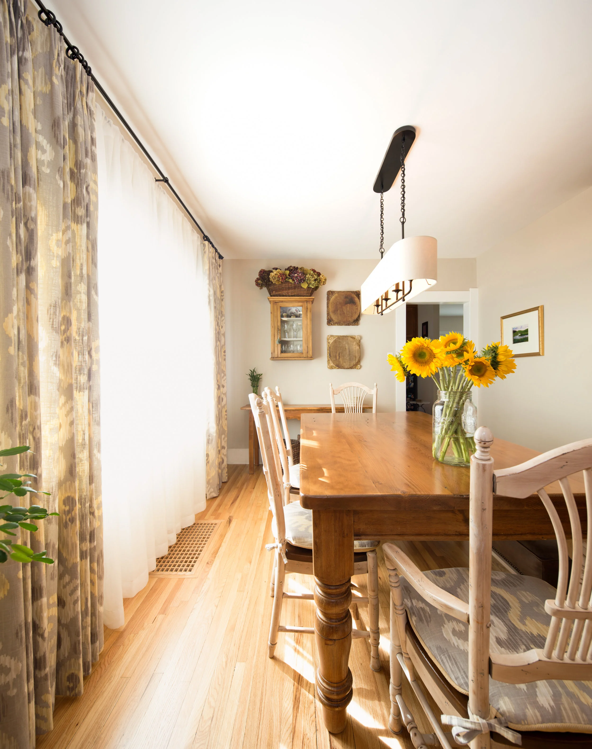 Another view of the simple, craftsman dining room with gorgeous Colorado sunshine filtered through linen sheers! &nbsp;