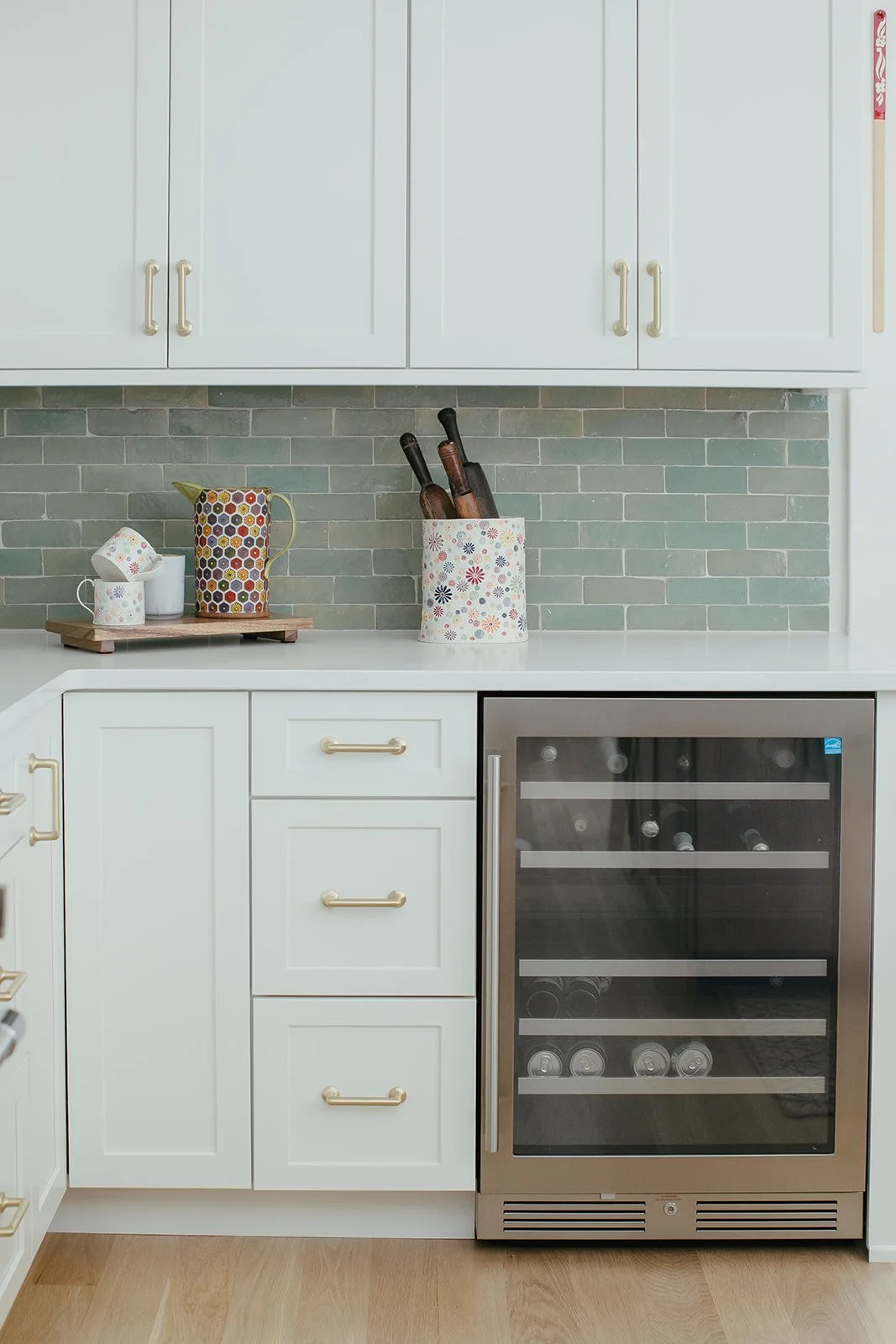 green tile white kitchen with wine fridge.jpg