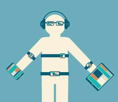 Image from BetaNews.com. Cartoon person wearing several high-tech devices such as watches, glasses, headphones, belt, heart rate monitor and is holding an iPad and iPhone.