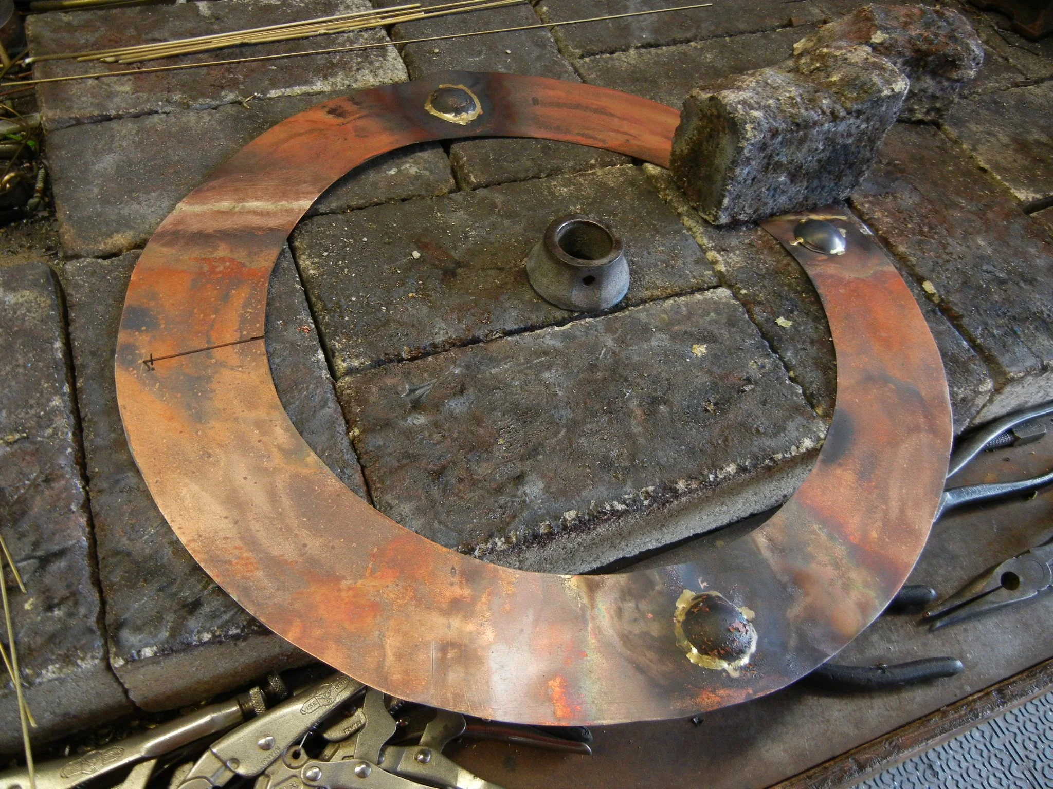 I decided on a porthole that the shark would be busting through, here you see the making of a rivet. Where's Rosy Riveter when you need her?