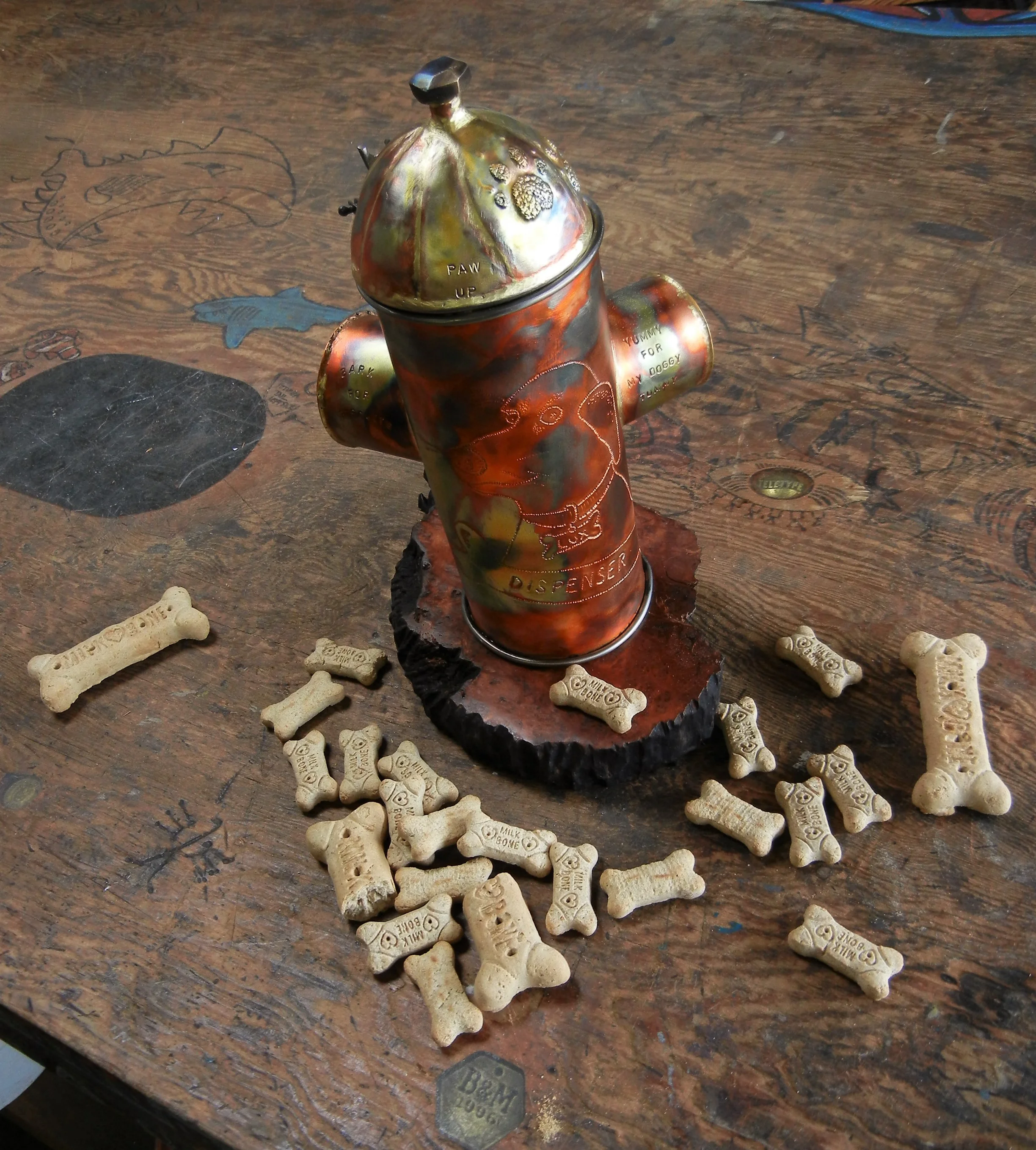  Copper and steel, some brass for glue and a nice Redwood burl base, we’ll see how long this dog bone lasts! 